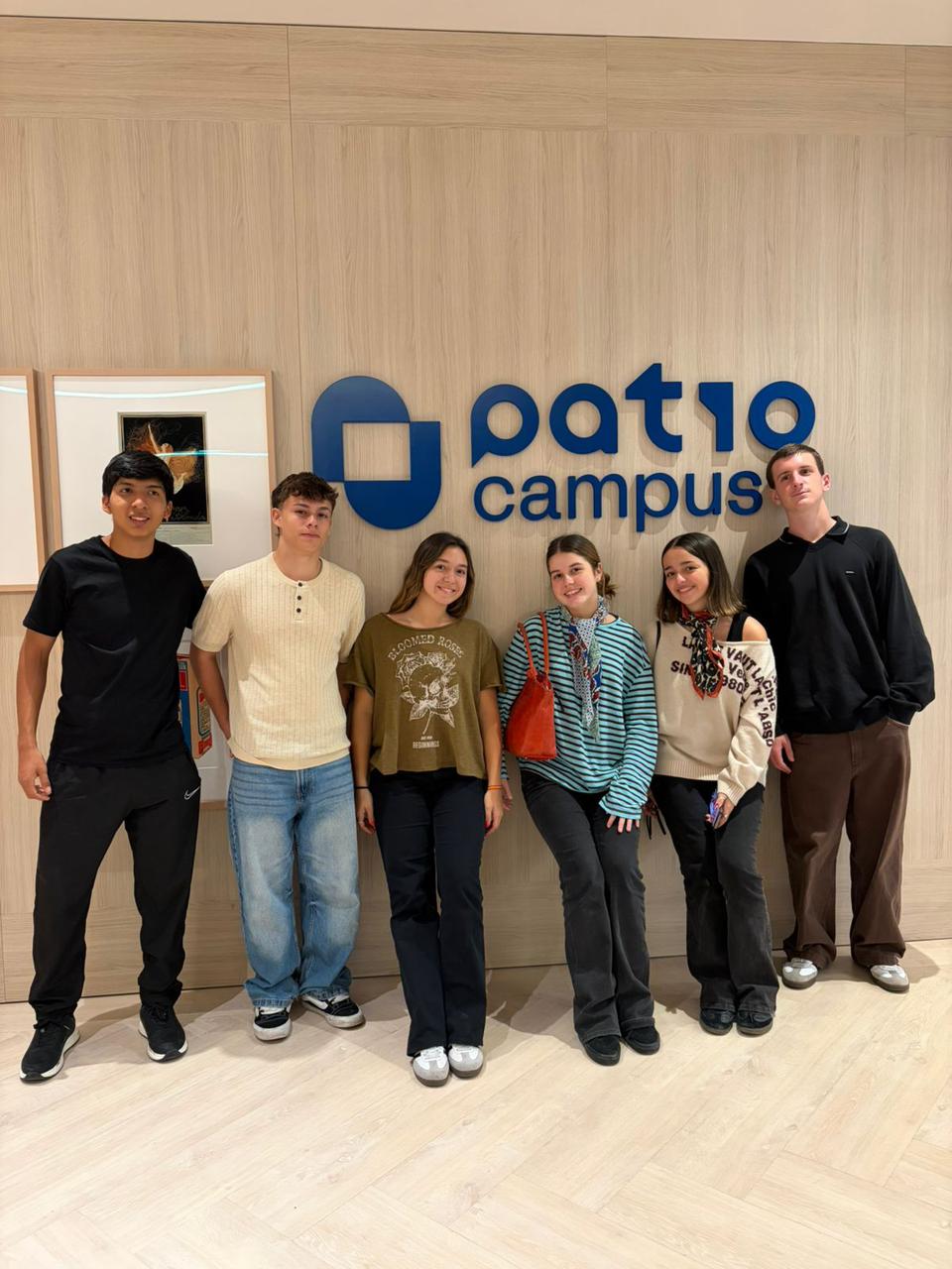 Team posing at Patio Campus